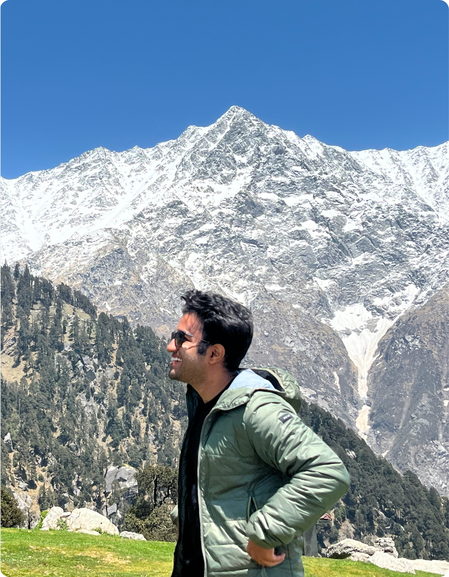 Atharva in front of a snowy peak